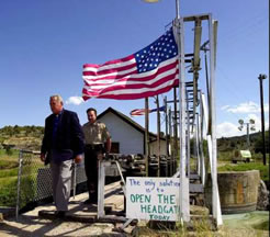 U.S. Marshal Reggie Madsen, left, and Klamath Falls Sheriff Tim Evinger leave after inspecting the headgate to upper Klamath Lake in Klamath Falls, Oregon on July 13
